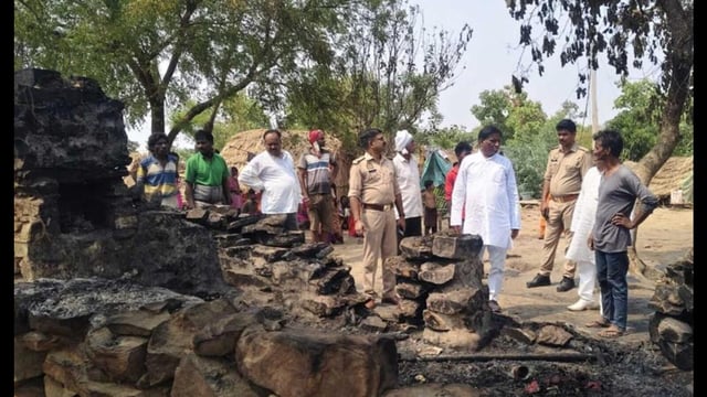 Officials inspect the scene where a hut was reduced to ashes in a lightning strike, killing four members of a family, in Prayagraj. (HT Photo)
