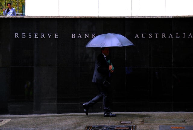 Pedestrians walk past the Reserve Bank of Australia building in central Sydney, Australia, March 7, 2017. REUTERS/David Gray/File Photo
