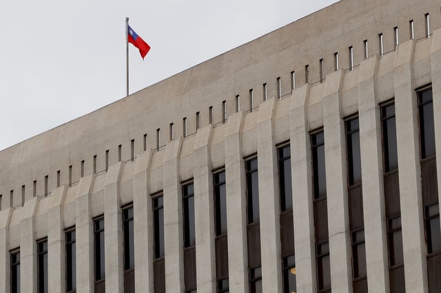 A Taiwanese flag is seen on top of Taiwan's central bank in Taipei, Taiwan, December 14, 2022. REUTERS/Ann Wang/File Photo