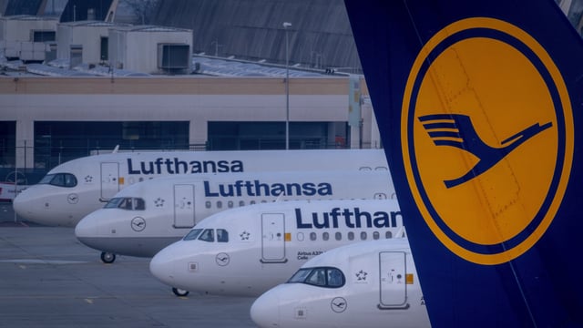 Lufthansa aircrafts are parked at the airport in Frankfurt, Germany.