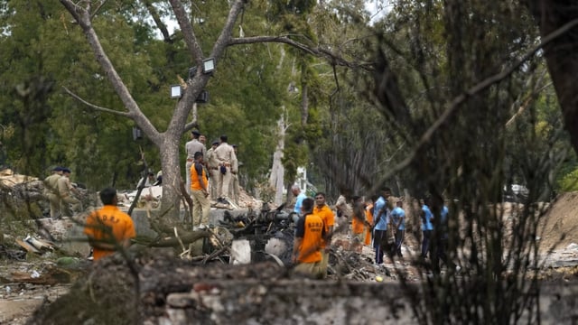 SDRF and police personnel at the site of the Air India plane crash, in Ahmedabad on June 13, 2025.