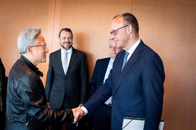 Nvidia CEO Jensen Huang speaks to German Chancellor Friedrich Merz during their meeting at the Chancellery in Berlin, Germany, June 13, 2025. Steffen Kugler/Bundesregierung/Handout via REUTERS/File Photo