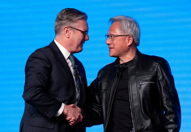 British Prime Minister Keir Starmer shakes hands with Jensen Huang, CEO of Nvidia, after a panel discussion at London Tech Week, in London, Britain, June 9, 2025. Carl Court/Pool via REUTERS/File Photo