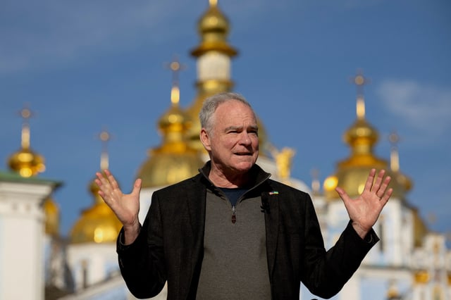 U.S. Senator Tim Kaine (D-VA) speaks to members of the media in front of Saint Michael's Cathedral, amid Russia's attack on Ukraine, in Kyiv, Ukraine April 14, 2025.  REUTERS/Thomas Peter/File Photo
