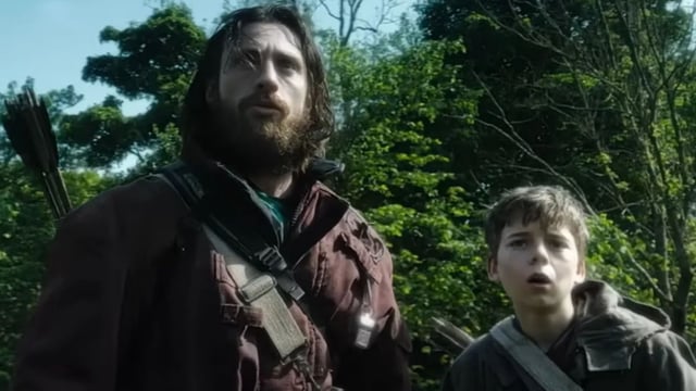 Aaron Taylor Johnson and a child in 28 Years Later