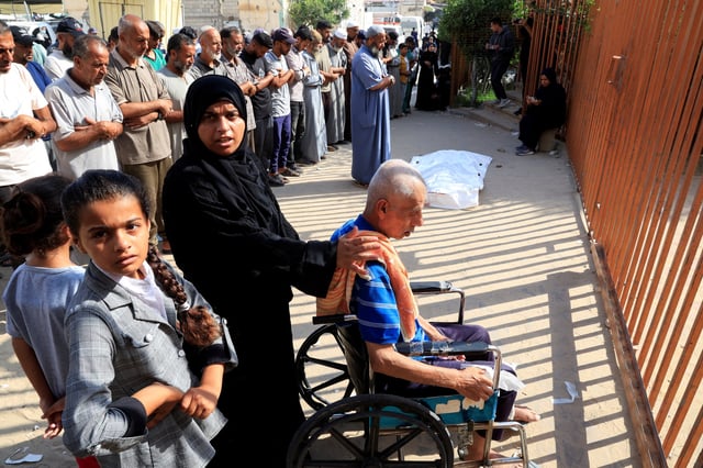 Mourners attend the funeral of Palestinians killed in what the Gaza health ministry says was Israeli fire near a distribution center in Rafah, at Nasser Hospital in Khan Younis, in the southern Gaza Strip, June 16, 2025. REUTERS/Hatem Khaled