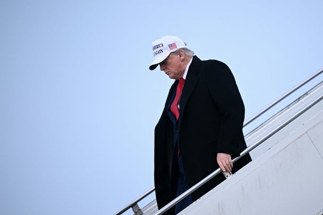 US President Donald Trump steps off of Air Force One upon arrival at Calgary International Airport, before the start of the G7 summit, in Calgary, Alberta, Canada, June 15, 2025.