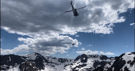 Helicopter transports skier off Skywalker Couloir June 2025