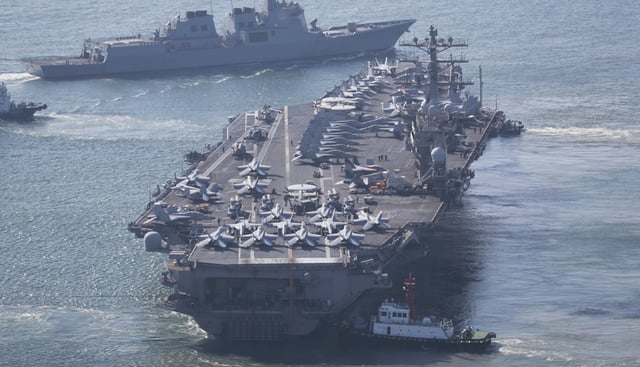 The U.S. Navy&#39;s nuclear-powered aircraft carrier USS Nimitz departs a naval base in Busan, South Korea, Sunday, April 2, 2023.