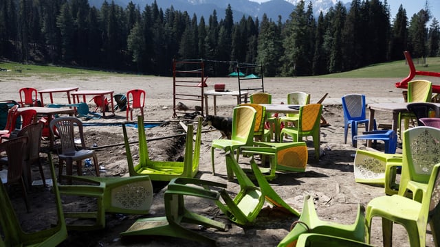 Chairs and tables scattered at the site of terrorist attack on tourists in Baisaran near Pahalgam in south Kashmir's Anantnag district.