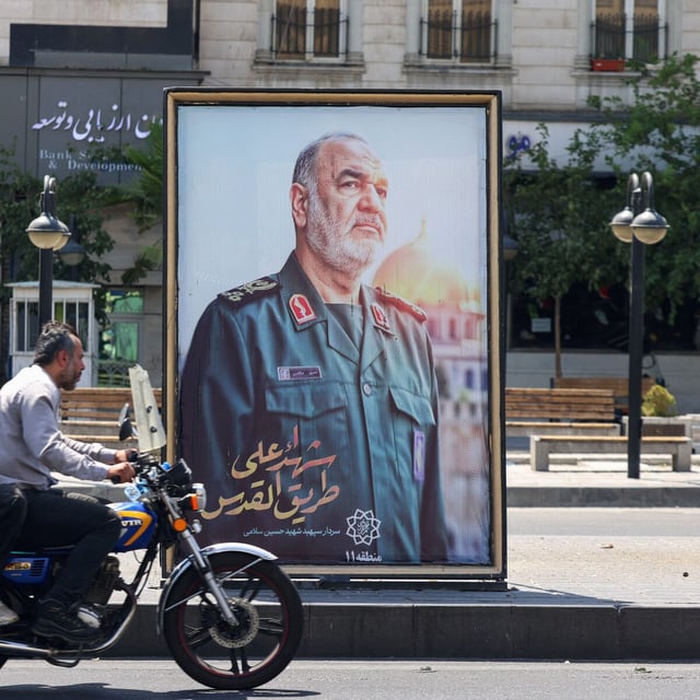 A poster of slain Iranian Islamic Revolutionary Guard Corps (IRGC) commander Hossein Salami, killed following Israeli strikes on targets in Iran, is set up at a Tehran square on June 16.