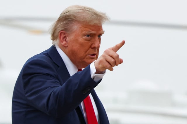 U.S. President Donald Trump points a finger as he departs for Canada to attend the G7 Leaders' Summit, from Joint Base Andrews in Maryland, U.S., June 15, 2025.