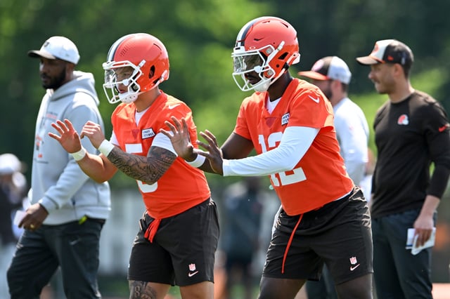 Shedeur Sanders #12 and Dillon Gabriel #5 of the Cleveland Browns run a drill during Cleveland Browns mandatory minicamp at CrossCountry Mortgage Campus on June 11, 2025 in Berea, Ohio.