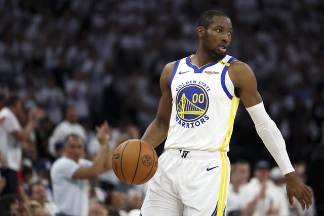 MINNEAPOLIS, MINNESOTA - MAY 14: Jonathan Kuminga #00 of the Golden State Warriors handles the ball during the first quarter of Game Five of the Western Conference Second Round NBA Playoffs against the Minnesota Timberwolves at Target Center on May 14, 2025 in Minneapolis, Minnesota.