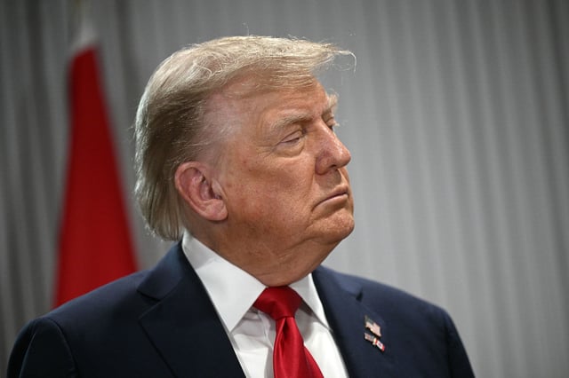 President Donald Trump looks on as Canadian Prime Minister Mark Carney speaks as they meet during the Group of Seven Summit at the Pomeroy Kananaskis Mountain Lodge in Kananaskis, Alberta, Canada on June 16.