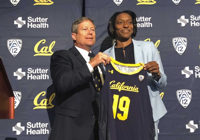 University of California-Berkeley Athletics Director Jim Knowlton poses with women&#39;s basketball head coach Charmin Smith during her introduction as a new hire at a news conference June 25, 2019, in Berkeley, Calif.