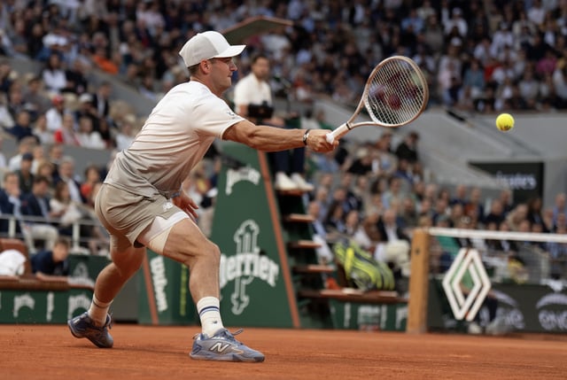 Jun 3, 2025; Paris, FR; Tommy Paul of the United States returns a shot during his match  against Carlos Alcaraz of Spain on day 10 at Roland Garros Stadium.  Mandatory Credit: Susan Mullane-Imagn Images/File Photo