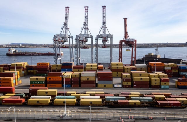 An aerial view shows a ship sailing past the Port of Montreal in Montreal on Thursday, Nov.14, 2024.  THE CANADIAN PRESS/Christinne Muschi