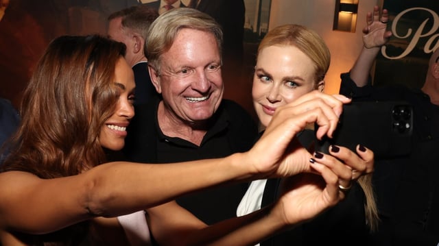 Ronald Burkle, owner of Soho House, flanked by Zoe Saldana and Nicole Kidman, faces dozens of objections to the proposal