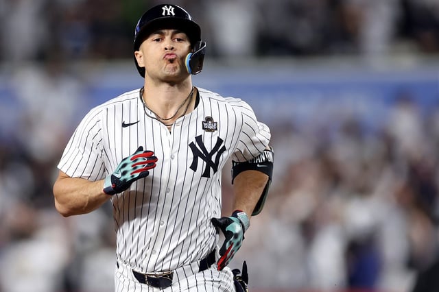NEW YORK, NEW YORK - OCTOBER 30:  Giancarlo Stanton #27 of the New York Yankees rounds the bases after hitting a solo home run during the third inning of Game Five of the 2024 World Series against the Los Angeles Dodgers at Yankee Stadium on October 30, 2024 in the Bronx borough of New York City. (Photo by Sarah Stier/Getty Images)
