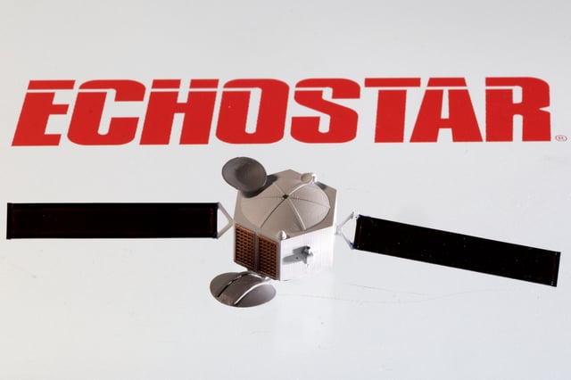A satellite model is placed on EchoStar Satellite Services logo in this picture illustration taken April 4, 2022. REUTERS/Dado Ruvic/Illustration/File photo