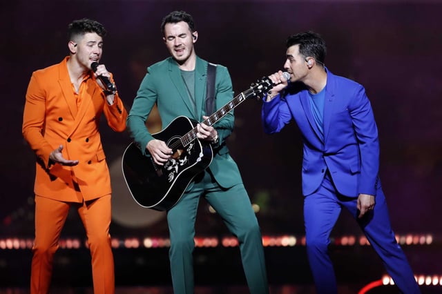 Jonas Brothers (left to right) Nick, Kevin and Joe, perform at Chase Center in San Francisco on October 8, 2019. The group has scrapped stadium shows in six major U.S. cities on their upcoming “Jonas20: Living the Dream Tour,” opting instead for smaller venues amid what appears to be soft ticket sales.