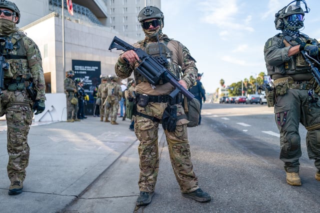 Federal agents guard outside of a federal building and Immigration and Customs Enforcement (ICE) detention center on June 13, 2025, in Los Angeles, California. Demonstrations continue after a series of immigration raids began last Friday, June 6th. Tensions in the city remain high after the Trump administration called in the National Guard and the Marines against the wishes of city leaders. (Photo by Spencer Platt/Getty Images)