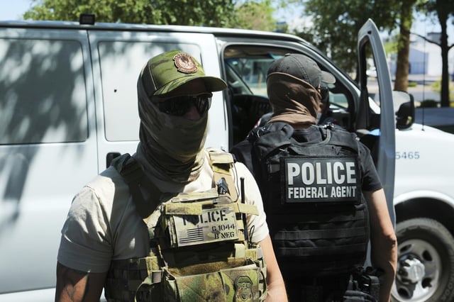 ICE and HSI police make an arrest outside immigration court in Phoenix on May 21, 2025.