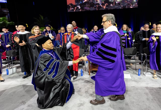 Northwestern University Commencement speaker Steve Carell shares a dance moment during an impromptu dance break with School of Communication Dean, E. Patrick Johnson.
