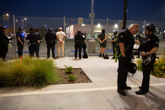 13 June 2025, US, Los Angeles: LAPD officers arrest demonstrators who did not leave the curfew zone after 8pm on June 13, 2025 in Downtown Los Angeles on June 13, 2025 after a demonstration against immigration raids by ICE. Photo: Zin Chiang/dpa (Photo by Zin Chiang/picture alliance via Getty Images)