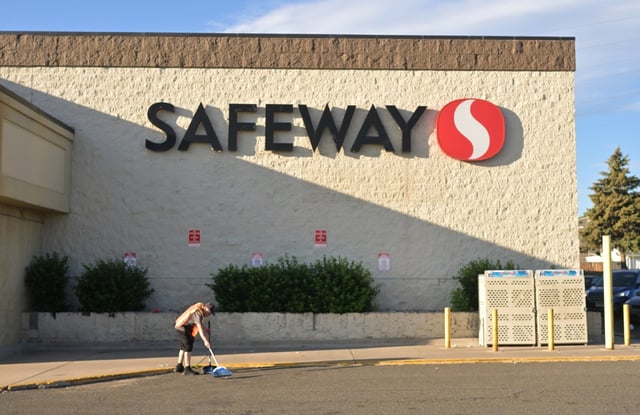 Peter Fowler, an employee at the Safeway grocery store at Garrison Street and West Colfax Avenue in Denver, cleans up outside the store on June 16, 2025. Although Safeway employees across Colorado recently began a limited strike, no picket line was present at this location. (Photo by RJ Sangosti/The Denver Post)