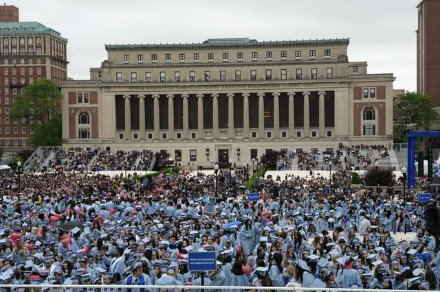 Students attend the Commencement Ceremony at Columbia University in New York City in Manhattan, New York, U.S., May 21, 2025. Juan Arredondo/Pool via REUTERS/File Photo