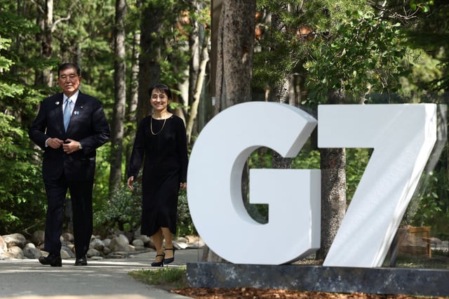 Japan's Prime Minister Shigeru Ishiba and his wife Yoshiko Ishiba arrive at the G7 summit in Kananaskis, Alberta, Canada,  June 16, 2025.  REUTERS/Kevin Lamarque