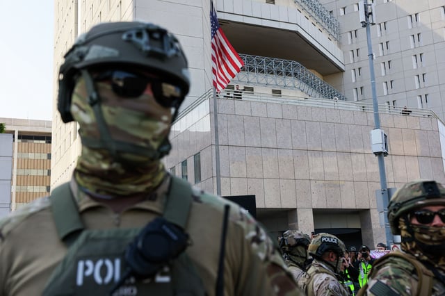 The face covering donned by this officer outside a federal building and Immigration and Customs Enforcement detention center in downtown Los Angeles on June 13 would be prohibited under new proposed legislation. 