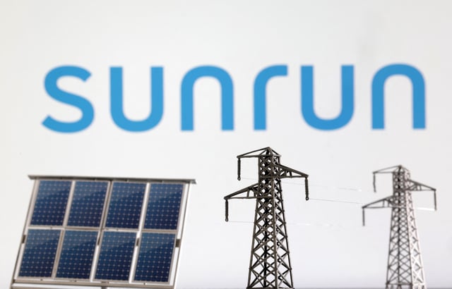 Miniatures of solar panel and electric pole are seen in front of Sunrun logo in this illustration taken January 17, 2023. REUTERS/Dado Ruvic/Illustration/File Photo