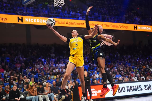 Sparks forward Dearica Hamby, left, shoots as Dallas Wings guard DiJonai Carrington defends during the second half of a WNBA basketball game in Dallas, Friday, June 6, 2025. (AP Photo/LM Otero)