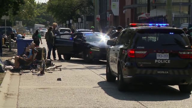 Victoria police on Pandora Avenue on Wednesday, Aug. 7, 2024. 