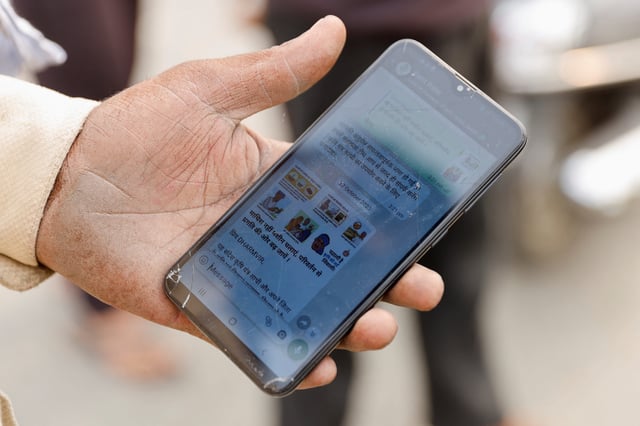 A farmer shows the WhatsApp group on which they can book baler machines from state government, in a village in Karnal district in the northern state of Haryana, India, November 4, 2023.