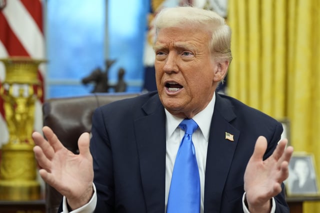 President Donald Trump speaks with reporters in the Oval Office at the White House, Tuesday, Feb. 11, 2025, in Washington. 