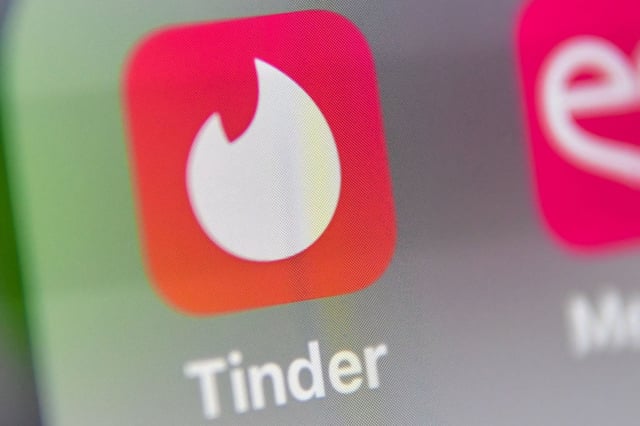 The Tinder logo on a tablet.