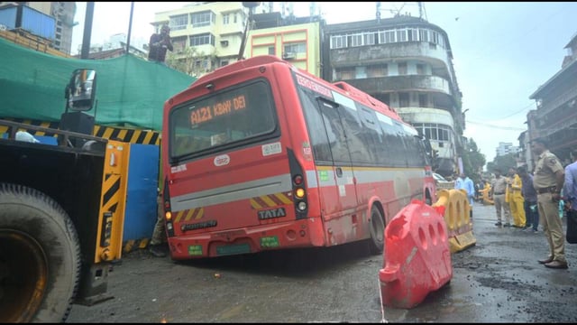 While the bus was travelling along Babasaheb Jaykar Marg, the road caved in, causing the rear left tyre to sink into the depression (Bhushan Koyande/HT Photo)