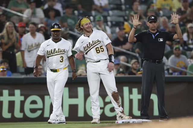 Athletics&#39; Willie MacIver (65) reacts after taking third base on a throwing error by Houston Astros catcher Victor Caratini (not shown) during the fifth inning of a baseball game Monday, June 16, 2025, in West Sacramento, Calif. (AP Photo/Scott Marshall)