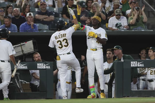 Athletics&#39; JJ Bleday (33) and Lawrence Butler, center right, celebrate after a solo home run by Bleday against the Houston Astros during the fifth inning of a baseball game Monday, June 16, 2025, in West Sacramento, Calif. (AP Photo/Scott Marshall)