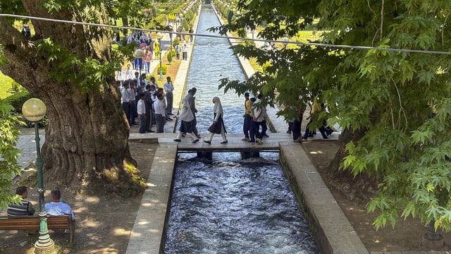 People visited Verinag Mughal Garden after it was reopened, in Jammu and Kashmir on Tuesday.