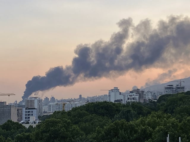 Smoke rises from the building of Iran&#39;s state-run television after an Israeli strike in Tehran, Iran, Monday, June 16, 2025.