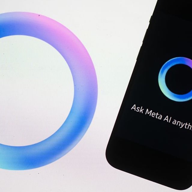 The logo of the AI software Meta AI from the Facebook group Meta is displayed on the screen of a laptop and iPhone.