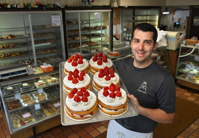 Charles Hergenroeder is the owner of Woodlea Bakery in Baltimore holds a tray of their homemade strawberry shortcakes. The bakery was named best in Baltimore. (Lloyd Fox/Staff)