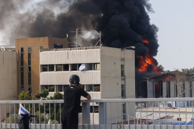 Fire and smoke from an Iranian missile strike in Hertzliya, Israel, on Tuesday, June 17, 2025. Iran fired several waves of drones and missiles over the last 24 hours, while Israel continued hitting Tehran, killing one more senior military official and setting the state-television complex ablaze with a strike during a live broadcast. 
