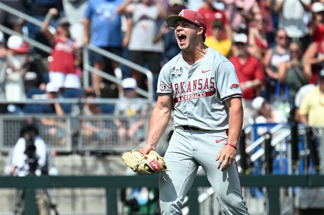 Jun 16, 2025; Omaha, Neb, USA; Arkansas Razorbacks starting pitcher Gage Wood (14) celebrates completing a no hitter \against the Murray State Racers at Charles Schwab Field. Mandatory Credit: Steven Branscombe-Imagn Images