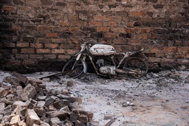 A burnt bike remains following a deadly gunmen attack in Yelewata, Benue State, Nigeria, June 16, 2025. REUTERS/Marvellous Durowaiye